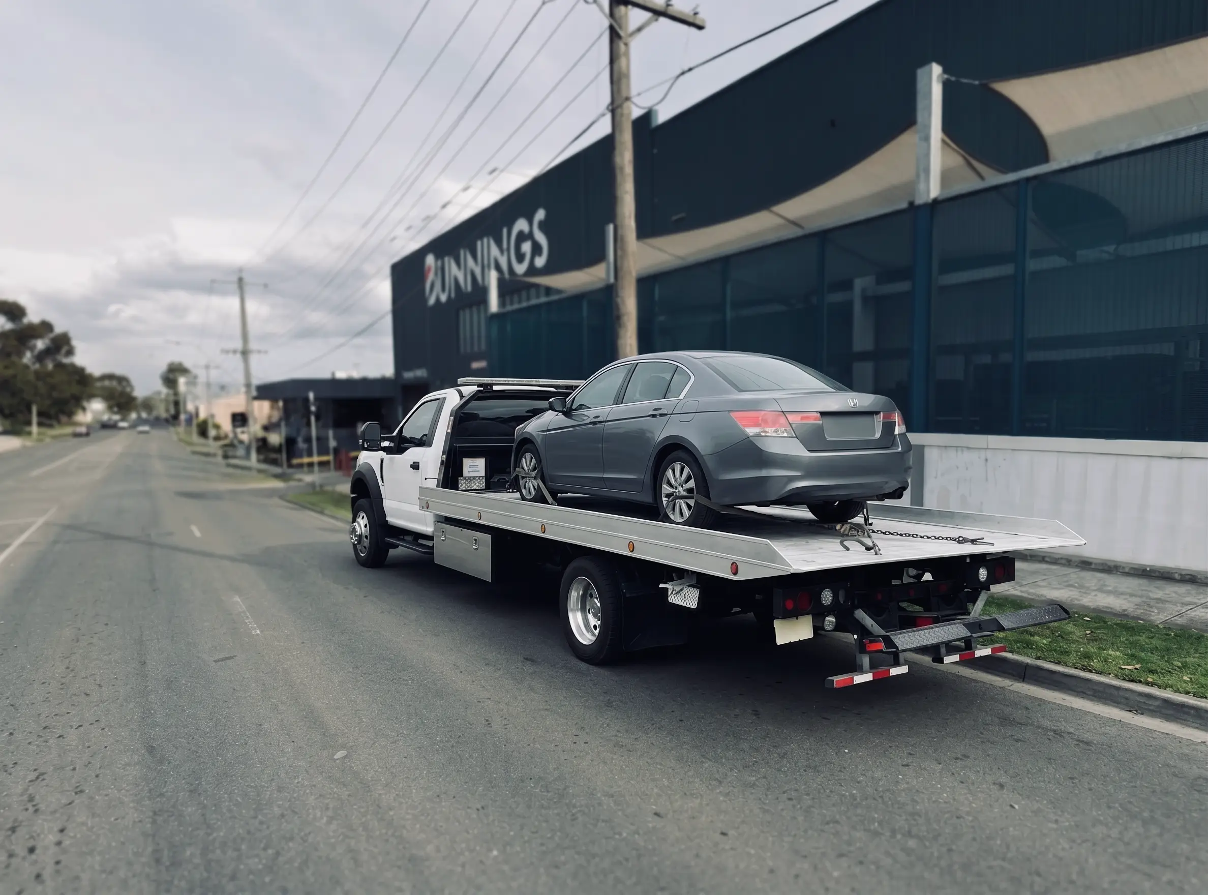 Car breakdown loaded in tow truck in Northcote